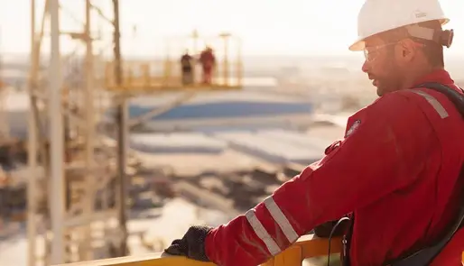 Service technician looking at rigsite